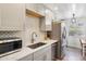 Updated kitchen with stainless steel appliances, granite countertops, and light-colored cabinetry at 7995 E Mississippi Ave # F23, Denver, CO 80247