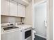 Laundry area with white washer and dryer and additional storage space at 7995 E Mississippi Ave # F23, Denver, CO 80247