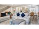 Living room featuring modern furniture, an open layout to the kitchen, and hardwood floors at 7995 E Mississippi Ave # F23, Denver, CO 80247
