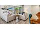 Cozy living room with two sofas, a fireplace, and a sliding glass door leading to the outside at 7995 E Mississippi Ave # F23, Denver, CO 80247