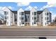 Modern townhome exterior featuring gray and white siding and contemporary architectural design at 5371 W 14Th Ave, Lakewood, CO 80214
