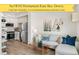 Inviting living room and kitchen showcasing stainless steel appliances and modern decor at 5371 W 14Th Ave, Lakewood, CO 80214