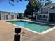 Community pool with sunning area and lounging birds at 14226 E 1St Dr # B10, Aurora, CO 80011