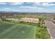 Aerial neighborhood with grassy sports fields, running track, sandlot and parking at 4553 Red Deer Trl, Broomfield, CO 80020