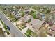 Aerial view of a residential neighborhood with mature trees and well-maintained lawns on a sunny day at 4553 Red Deer Trl, Broomfield, CO 80020