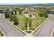 Aerial view of neighborhood park with playground, walking paths, and surrounding houses at 4553 Red Deer Trl, Broomfield, CO 80020