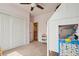 Bright bedroom with pink walls featuring plush carpet, a large closet, and a lofted bunk bed at 4553 Red Deer Trl, Broomfield, CO 80020