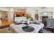 Dining room featuring a table set for four next to the kitchen, living room, and hardwood floors at 4553 Red Deer Trl, Broomfield, CO 80020