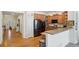 Kitchen features stainless steel appliances, hardwood floors, a breakfast bar, and plenty of cabinet space at 4553 Red Deer Trl, Broomfield, CO 80020