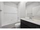 Bathroom with shower over tub, and vanity with dark wood cabinets at 19059 E 94Th Pl, Commerce City, CO 80022
