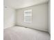 Bedroom with neutral carpet and ample light from the window at 19059 E 94Th Pl, Commerce City, CO 80022