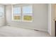 Bedroom featuring two windows overlooking the outside scenery at 19059 E 94Th Pl, Commerce City, CO 80022