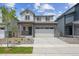 Charming two-story home with a two-car garage, a landscaped front yard, and a welcoming entrance at 19059 E 94Th Pl, Commerce City, CO 80022