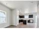 Open-concept kitchen with dark cabinets, stainless steel appliances, and a center island at 19059 E 94Th Pl, Commerce City, CO 80022