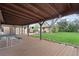 Charming covered wood deck perfect for outdoor dining and entertaining overlooking backyard at 865 S Everett St, Lakewood, CO 80226
