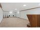 Large finished basement with neutral carpet, wood trim and additional seating at 865 S Everett St, Lakewood, CO 80226
