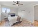 Bedroom featuring natural light, neutral color palette, and plush rug at 865 S Everett St, Lakewood, CO 80226