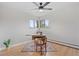Bright bedroom features hardwood floors, ample natural light, and cozy vintage sewing machine workstation at 865 S Everett St, Lakewood, CO 80226