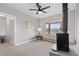Cozy living room with hardwood floors, a wood-burning stove, and large window overlooking the property at 865 S Everett St, Lakewood, CO 80226