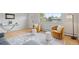 Stylish living room featuring hardwood floors, modern decor, and large windows for natural light and views at 865 S Everett St, Lakewood, CO 80226
