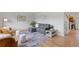 Cozy living room featuring hardwood floors, neutral walls, and stylish furniture creating a comfortable space at 865 S Everett St, Lakewood, CO 80226