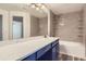Bright bathroom vanity area featuring a tub shower, and a modern design at 7433 S Quail Cir # 1924, Littleton, CO 80127