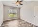 Comfortable bedroom showing wood floors, neutral walls, and a window at 7433 S Quail Cir # 1924, Littleton, CO 80127