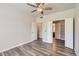 Spacious bedroom with multiple doors leading to bathroom and closets, complete with hard flooring at 7433 S Quail Cir # 1924, Littleton, CO 80127