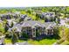 Exterior view of multi-story building featuring private balconies and well-maintained landscaping at 7433 S Quail Cir # 1924, Littleton, CO 80127