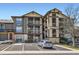 Condo building showcasing stucco and stone finishes, private balconies and reserved parking at 7433 S Quail Cir # 1924, Littleton, CO 80127