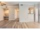 Bright living room featuring wood floors, an open layout, and a built-in desk area at 7433 S Quail Cir # 1924, Littleton, CO 80127