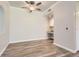 This open living room has wood floors, modern ceiling fan, and a built-in desk area at 7433 S Quail Cir # 1924, Littleton, CO 80127