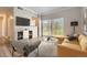 Cozy living room with a modern design and bright sunlight from the balcony at 7433 S Quail Cir # 1924, Littleton, CO 80127