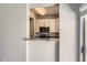 Kitchen pass-through window offering a view of the kitchen's appliances and design at 7433 S Quail Cir # 1924, Littleton, CO 80127