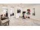 Versatile bonus room with exercise equipment, seating area, and neutral decor, perfect for fitness or relaxation at 21613 E 59Th Pl, Aurora, CO 80019
