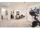 Bonus room with fitness equipment, and easy access to a convenient bathroom, a practical and stylish space at 21613 E 59Th Pl, Aurora, CO 80019