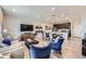 Open layout showcases stylish living, dining, and kitchen areas with modern finishes at 21613 E 59Th Pl, Aurora, CO 80019