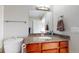 Bathroom featuring wooden vanity with granite countertop, and modern fixtures and an ensuite bathroom at 100 Park W Ave # 1806, Denver, CO 80205