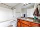 Bathroom featuring a shower-tub combo, wooden vanity with granite countertop, and modern fixtures at 100 Park W Ave # 1806, Denver, CO 80205