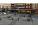 A modern building exterior with outdoor seating and parking, perfect for enjoying the city view at 100 Park W Ave # 1806, Denver, CO 80205
