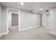 A finished basement provides extra living space with neutral carpet and light gray walls at 3855 N Cook St, Denver, CO 80205