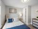 Comfortable bedroom with a plush bed, ample natural light, and stylish decor at 3855 N Cook St, Denver, CO 80205