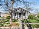 Charming cottage-style home with well-maintained lawn and classic architectural details at 3855 N Cook St, Denver, CO 80205