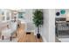 Bright entry featuring hardwood floors, an ornate tree, and views into the dining and bedroom at 3855 N Cook St, Denver, CO 80205