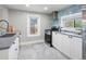 Bright kitchen with a stylish subway tile backsplash and stainless steel appliances at 3855 N Cook St, Denver, CO 80205