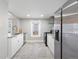 Spacious kitchen with stainless steel appliances and ample counter space at 3855 N Cook St, Denver, CO 80205