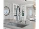 Modern kitchen sink with views to the dining room and front door at 3855 N Cook St, Denver, CO 80205