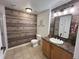 Charming bathroom with wooden wall and modern fixtures at 5800 N Tower Rd # 404, Denver, CO 80249