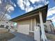 View of the community mailboxes featuring stone veneer accents and protective roof at 5800 N Tower Rd # 404, Denver, CO 80249