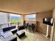 Comfortable balcony area with cushioned furniture and a view of the city at 300 W 11Th Ave # 10D, Denver, CO 80204